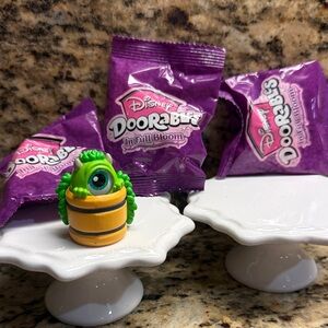 Disney Mike Doorable Figure In Full Bloom and three unopened bags of Full Bloom